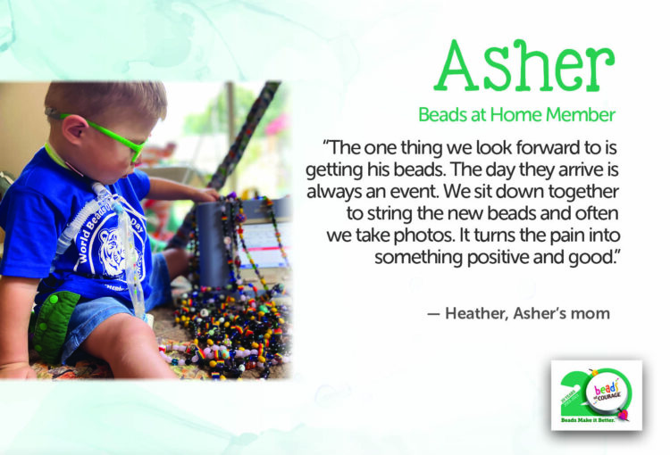 Asher is a little boy sitting on the floor looking at his collection of Beads of Courage