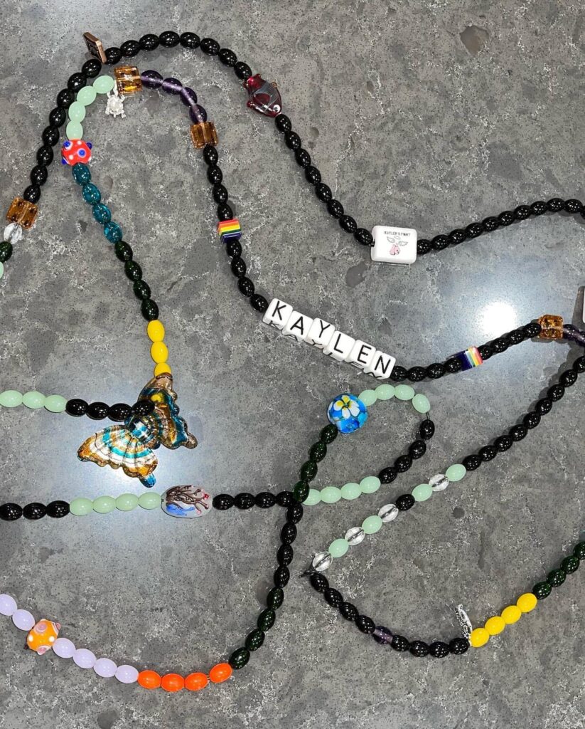 Photo of Kaylen's Beads of Courage and Kaylen's Fight Logo Bead for sponoring the program